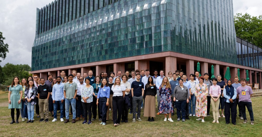 The approximately 50 attendees of the Degradation consortium meeting standing in front of Homerton College